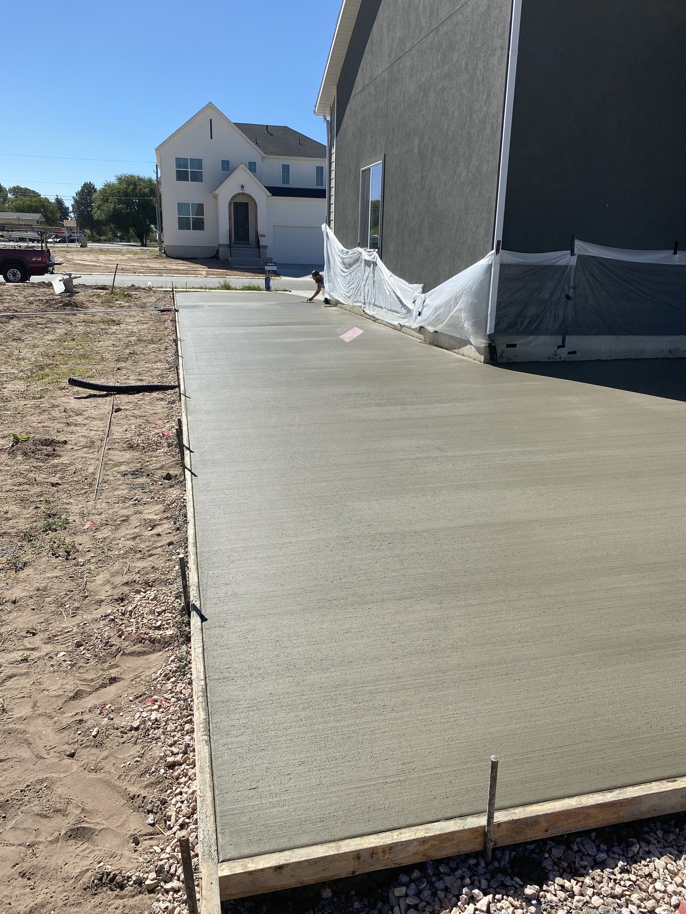 Real Bristow Concrete side-yard RV parking pad with driveway access